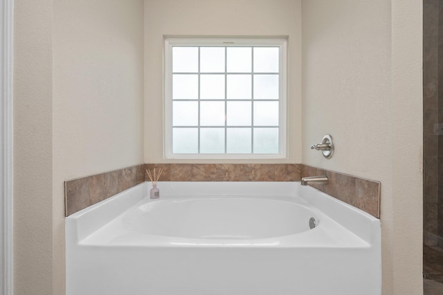 full bathroom featuring a bath