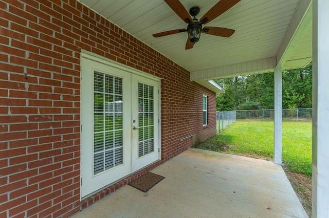 view of patio / terrace with fence, french doors, and ceiling fan