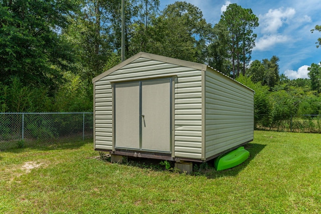 view of shed with fence