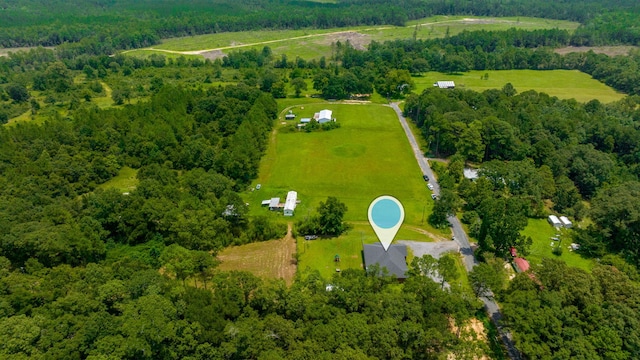 bird's eye view featuring a rural view and a forest view