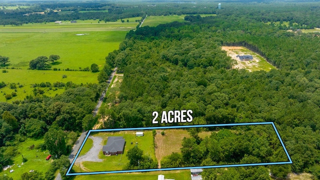 aerial view with a rural view and a view of trees