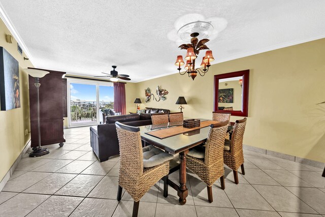 502 Gulf Shore Dr Unit 413, Destin, FL 32541 - dining area featuring crown molding, a chandelier, baseboards, a textured ceiling, and a ceiling fan