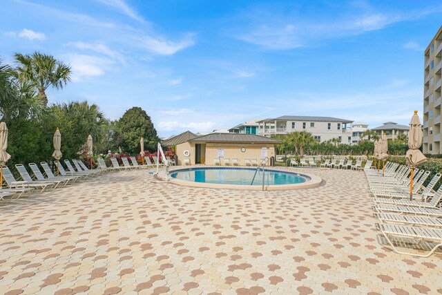 502 Gulf Shore Dr Unit 413, Destin, FL 32541 - community pool with a patio area