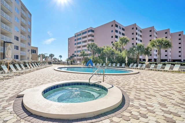 502 Gulf Shore Dr Unit 413, Destin, FL 32541 - community pool featuring a community hot tub and a patio