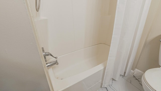bathroom with toilet and shower / bathtub combination with curtain
