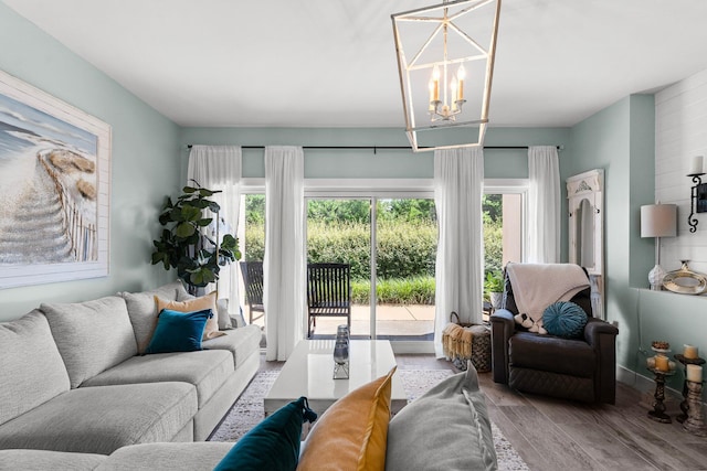 515 Topsl Beach Blvd # 106, Miramar Beach, FL 32550 - living room featuring wood finished floors and a notable chandelier