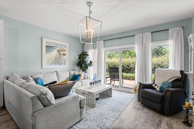515 Topsl Beach Blvd # 106, Miramar Beach, FL 32550 - living room featuring a notable chandelier and wood finished floors