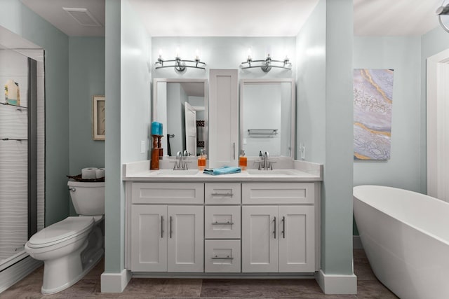 515 Topsl Beach Blvd # 106, Miramar Beach, FL 32550 - bathroom with a sink, double vanity, toilet, and visible vents