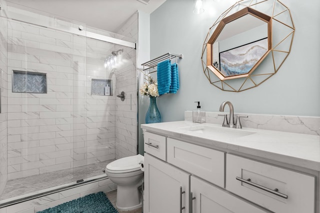 515 Topsl Beach Blvd # 106, Miramar Beach, FL 32550 - bathroom featuring vanity, toilet, and a stall shower