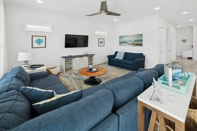 living room featuring recessed lighting, ornamental molding, ceiling fan, wood finished floors, and baseboards