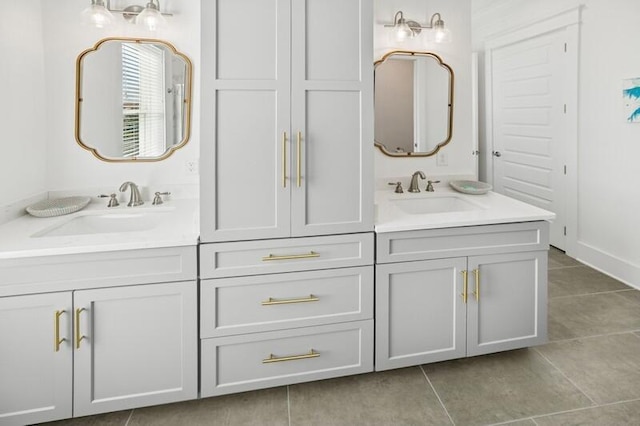 bathroom featuring tile patterned flooring and double vanity