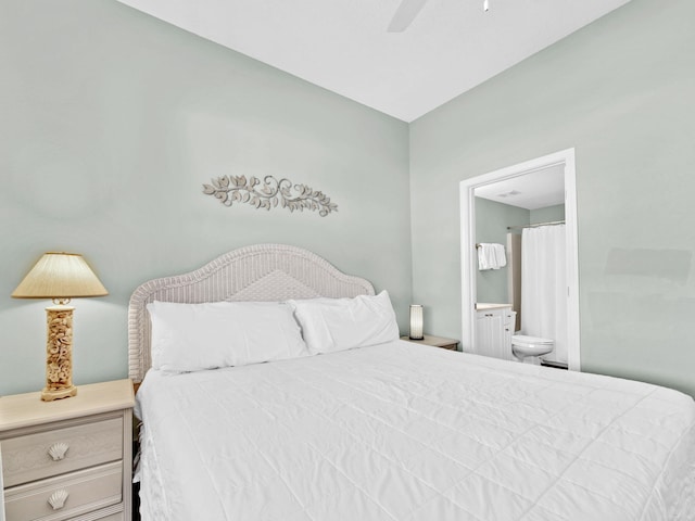 bedroom featuring ensuite bath and a ceiling fan