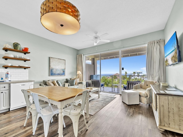dining room featuring wood finished floors and ceiling fan