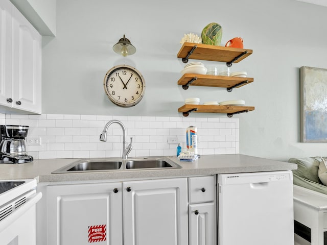 kitchen featuring white appliances, a sink, tasteful backsplash, white cabinetry, and open shelves