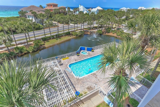 aerial view of a nearby body of water and a pool area
