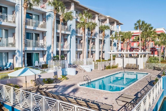 community pool featuring a patio area