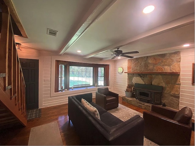 941 Walton Bridge Rd, Ponce De Leon, FL 32455 - living area with wood finished floors, stairs, ceiling fan, beam ceiling, and a wood stove