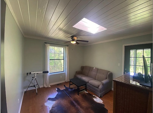 941 Walton Bridge Rd, Ponce De Leon, FL 32455 - living room featuring ornamental molding, a skylight, wood finished floors, baseboards, and a ceiling fan