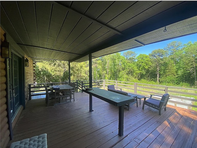 941 Walton Bridge Rd, Ponce De Leon, FL 32455 - deck with outdoor dining area and a view of trees