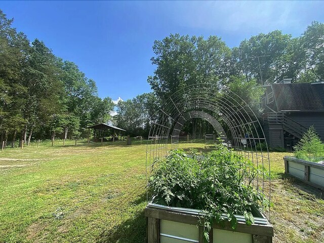 941 Walton Bridge Rd, Ponce De Leon, FL 32455 - view of grassy yard featuring a garden
