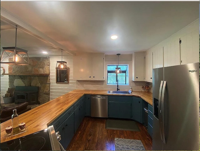 941 Walton Bridge Rd, Ponce De Leon, FL 32455 - kitchen with appliances with stainless steel finishes, a sink, dark wood finished floors, wooden counters, and white cabinetry
