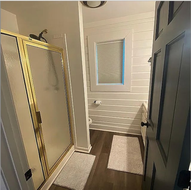 941 Walton Bridge Rd, Ponce De Leon, FL 32455 - full bathroom with a shower stall, wood finished floors, toilet, and baseboards