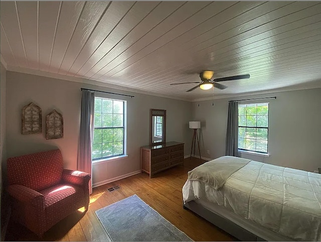 941 Walton Bridge Rd, Ponce De Leon, FL 32455 - bedroom with multiple windows, hardwood / wood-style floors, wooden ceiling, crown molding, and ceiling fan