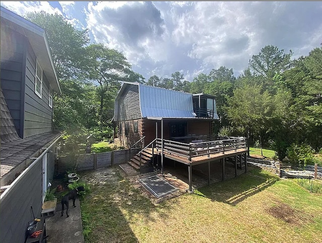 941 Walton Bridge Rd, Ponce De Leon, FL 32455 - rear view of house featuring a wooden deck, metal roof, and a gambrel roof