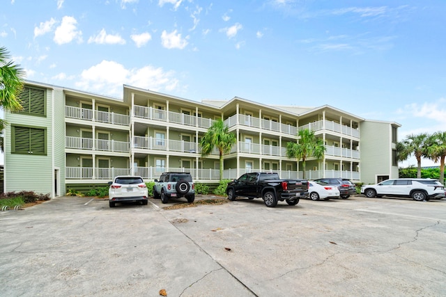 8294 E County Highway 30a Unit 1, Alys Beach, FL 32461 - view of apartment building / complex with uncovered parking