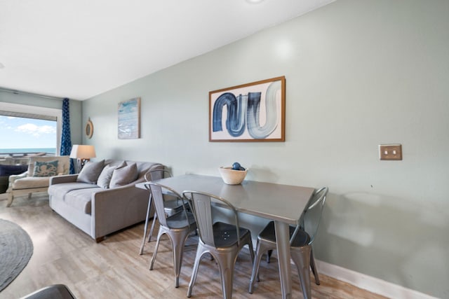 8294 E County Highway 30a Unit 1, Alys Beach, FL 32461 - dining room with wood finished floors and baseboards