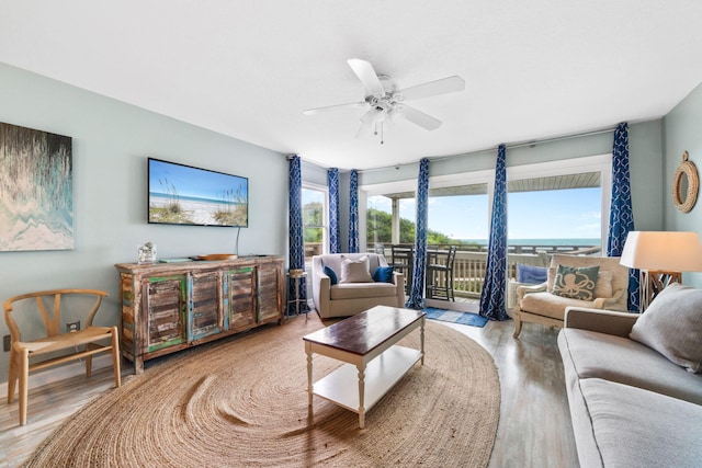 8294 E County Highway 30a Unit 1, Alys Beach, FL 32461 - living area with wood finished floors and a ceiling fan