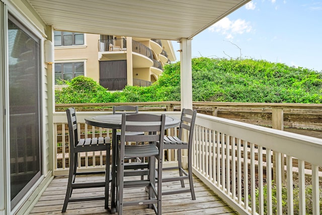 8294 E County Highway 30a Unit 1, Alys Beach, FL 32461 - view of wooden balcony with a wooden deck