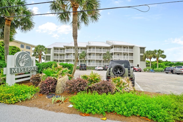 8294 E County Highway 30a Unit 1, Alys Beach, FL 32461 - view of building exterior with uncovered parking