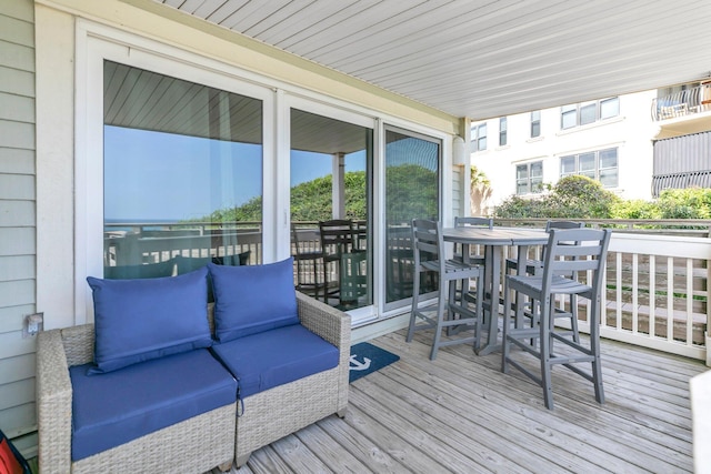 8294 E County Highway 30a Unit 1, Alys Beach, FL 32461 - wooden terrace with outdoor dining space