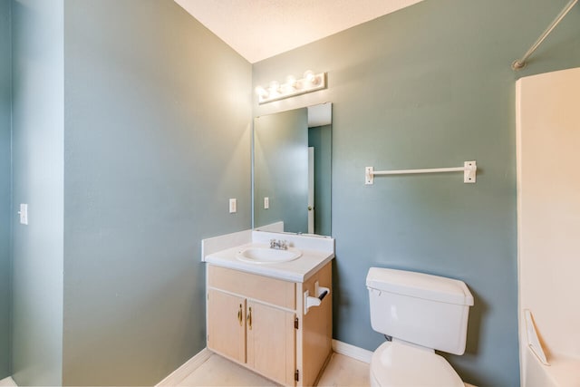15 Flora Cv, Crestview, FL 32539 - bathroom with toilet, vanity, and baseboards