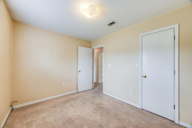 15 Flora Cv, Crestview, FL 32539 - unfurnished bedroom featuring light colored carpet and baseboards