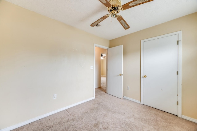 15 Flora Cv, Crestview, FL 32539 - unfurnished bedroom featuring carpet, baseboards, and a ceiling fan
