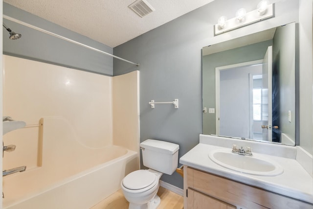 15 Flora Cv, Crestview, FL 32539 - bathroom featuring toilet, shower / tub combination, a textured ceiling, vanity, and baseboards