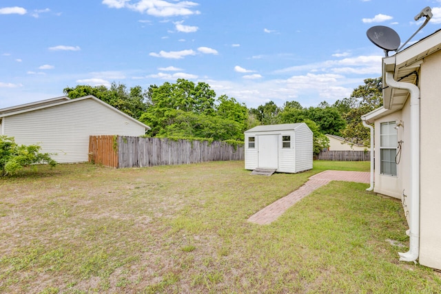 15 Flora Cv, Crestview, FL 32539 - view of yard featuring a storage unit and an outbuilding