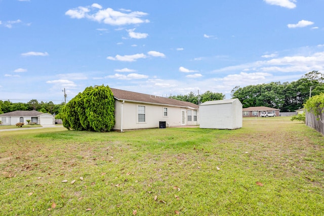 15 Flora Cv, Crestview, FL 32539 - view of yard with a storage shed, an outdoor structure, and cooling unit