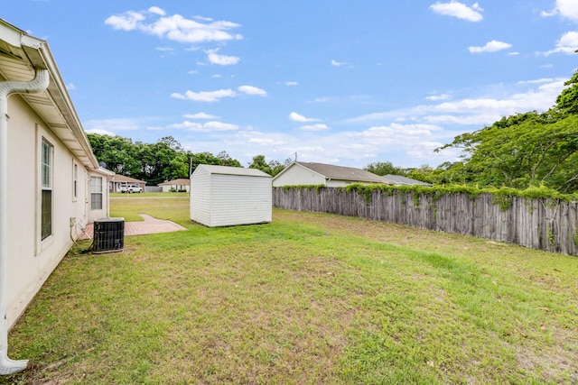 15 Flora Cv, Crestview, FL 32539 - view of yard with central AC unit, a storage shed, and an outbuilding