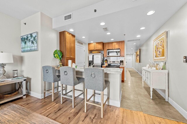 16701 Front Beach Rd Unit 605, Panama City Beach, FL 32413 - kitchen with a peninsula, baseboards, visible vents, and appliances with stainless steel finishes