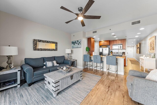 16701 Front Beach Rd Unit 605, Panama City Beach, FL 32413 - living room with light wood-style floors, visible vents, baseboards, and ceiling fan