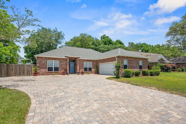 4475 New Market Rd, Niceville, FL 32578 - ranch-style house with a garage, decorative driveway, brick siding, and roof with shingles