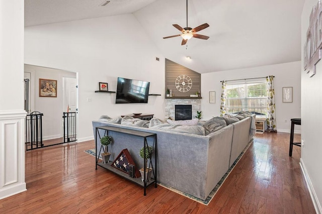 4475 New Market Rd, Niceville, FL 32578 - living room featuring high vaulted ceiling, ceiling fan, a fireplace, hardwood / wood-style floors, and baseboards