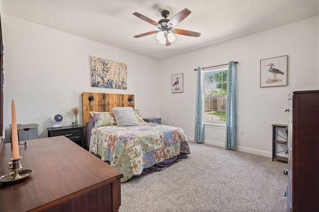 4475 New Market Rd, Niceville, FL 32578 - carpeted bedroom with baseboards, a textured ceiling, and ceiling fan