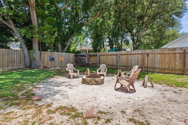 4475 New Market Rd, Niceville, FL 32578 - fenced backyard featuring an outdoor fire pit