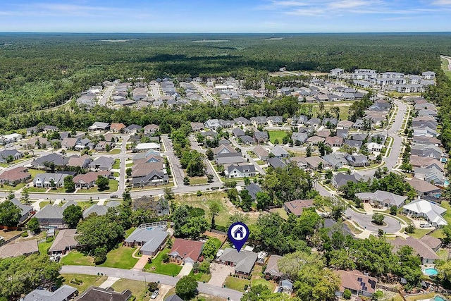 4475 New Market Rd, Niceville, FL 32578 - aerial view of property and surrounding area with a heavily wooded area and nearby suburban area