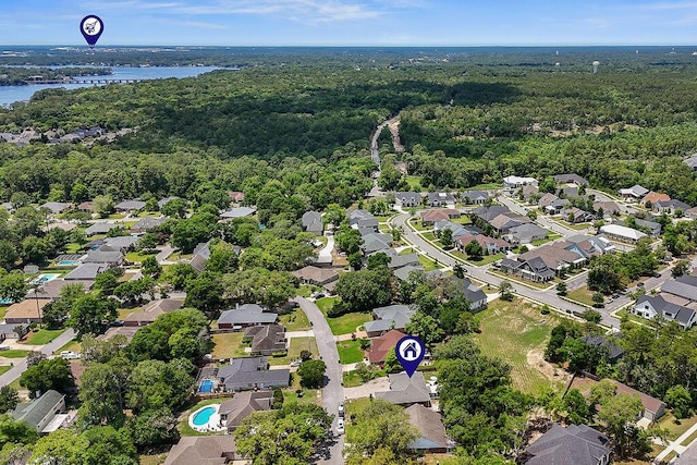 4475 New Market Rd, Niceville, FL 32578 - aerial perspective of suburban area with a heavily wooded area and a nearby body of water