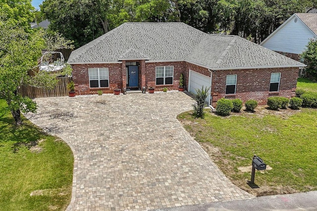 4475 New Market Rd, Niceville, FL 32578 - view of front of house featuring a garage, decorative driveway, brick siding, and roof with shingles